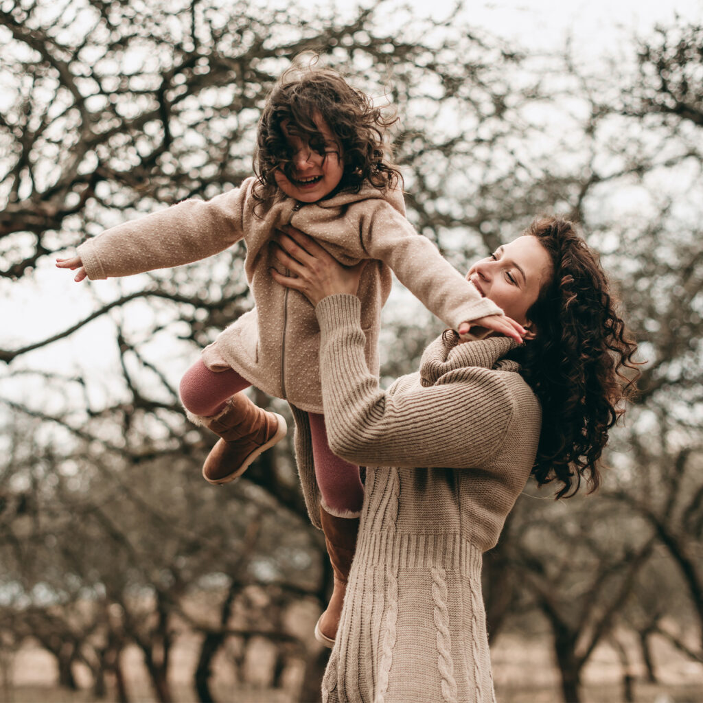 Mom and her daughter playing outside